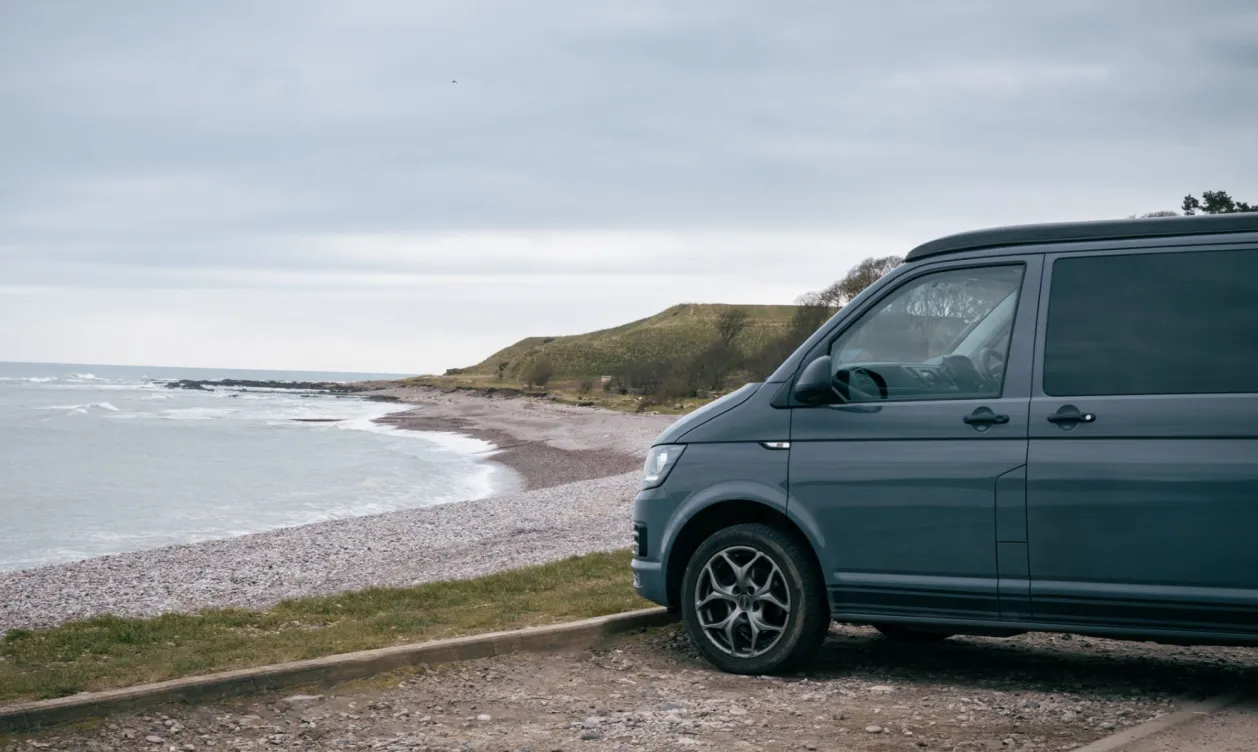 Grey Transported T6 parked at beach front